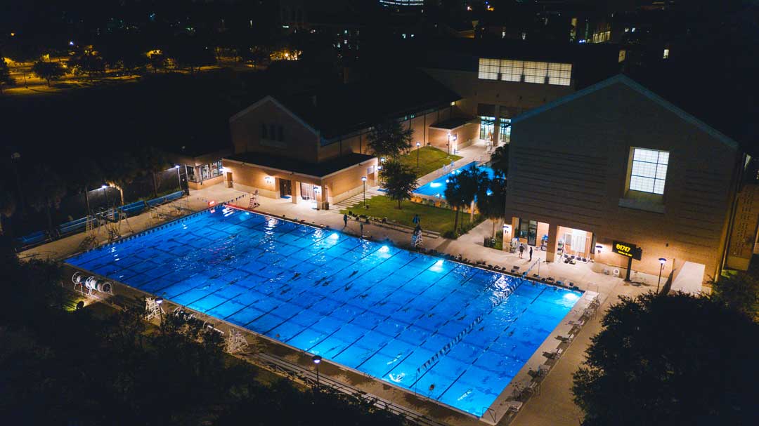 swimming pool at night on the Rice University campus.