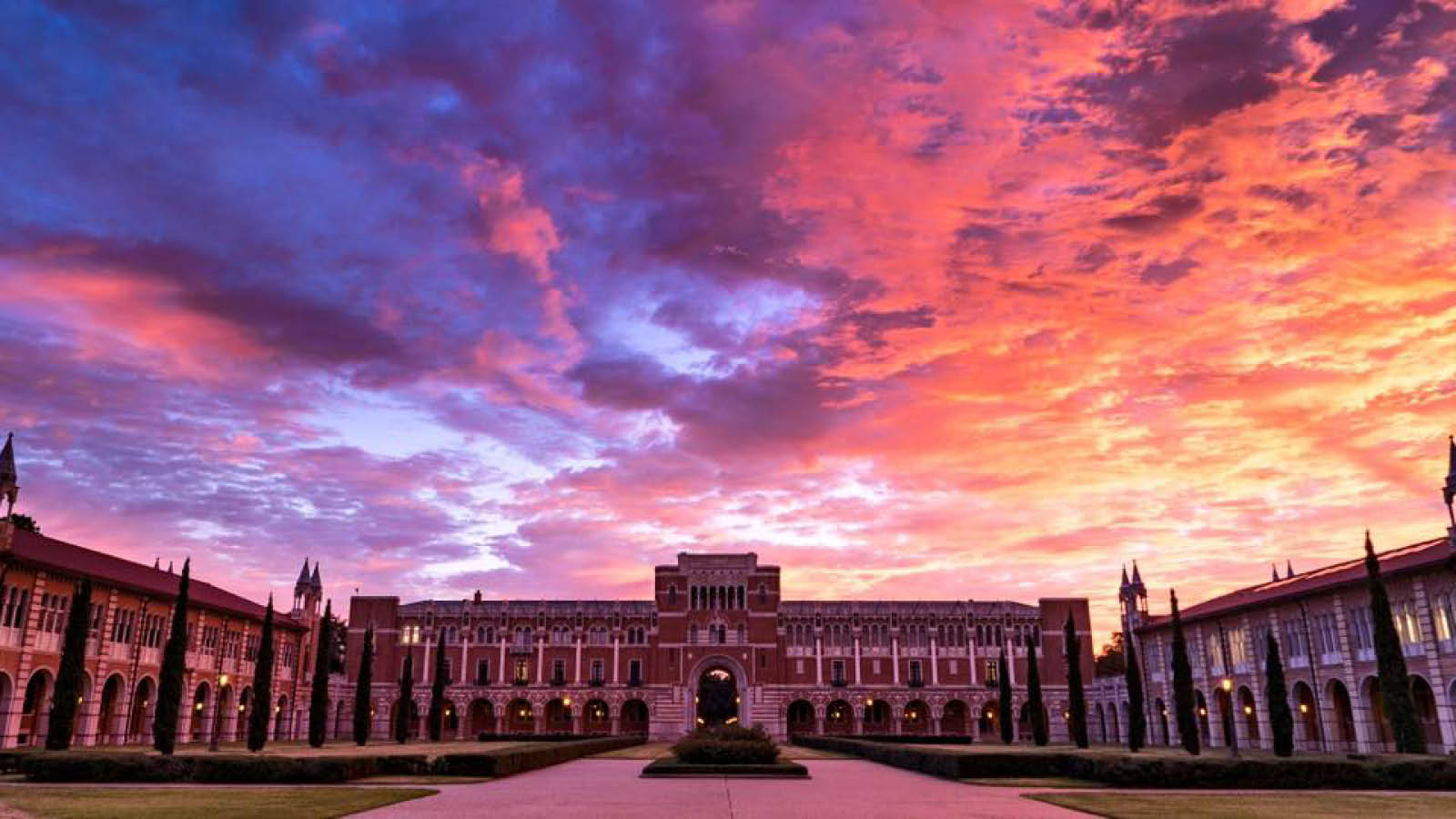 After a storm, the sky over Rice University glows purple, pink, yellow and orange.