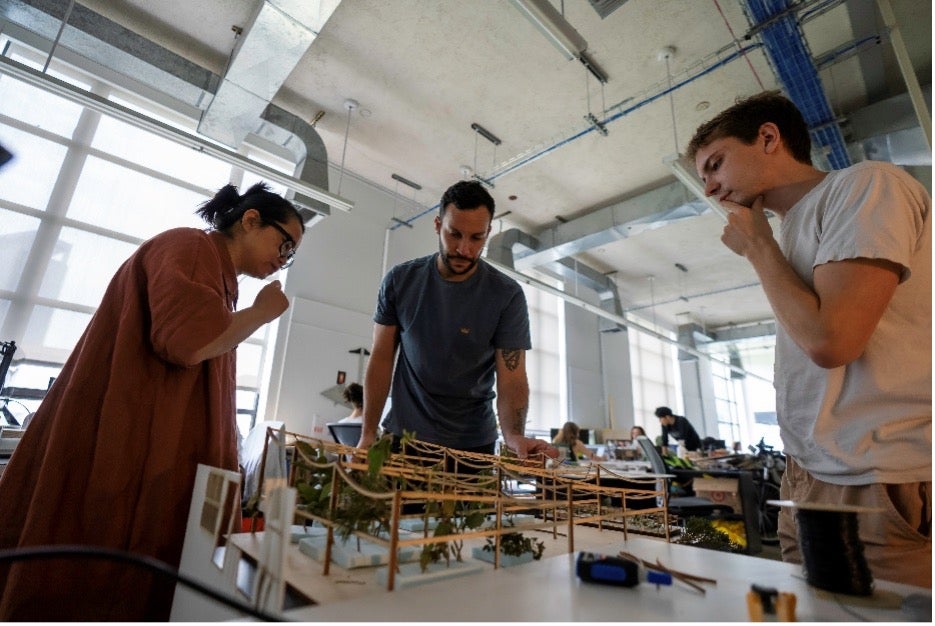 Students working a table.