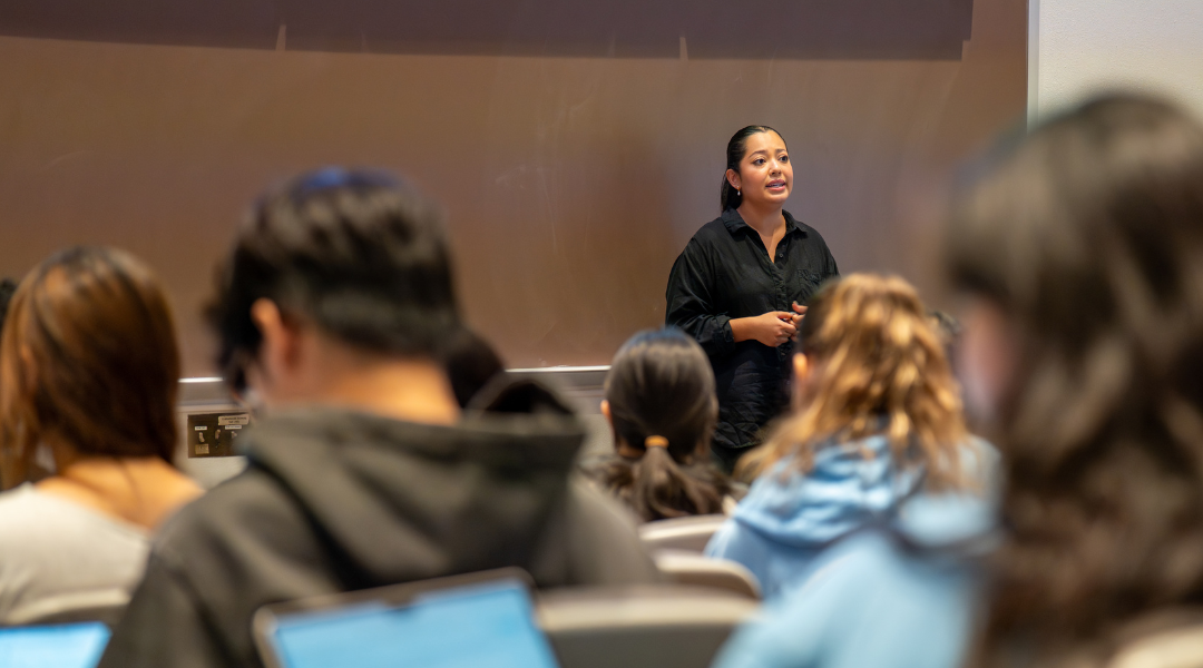 A graduate student teaching a class of undergraduates