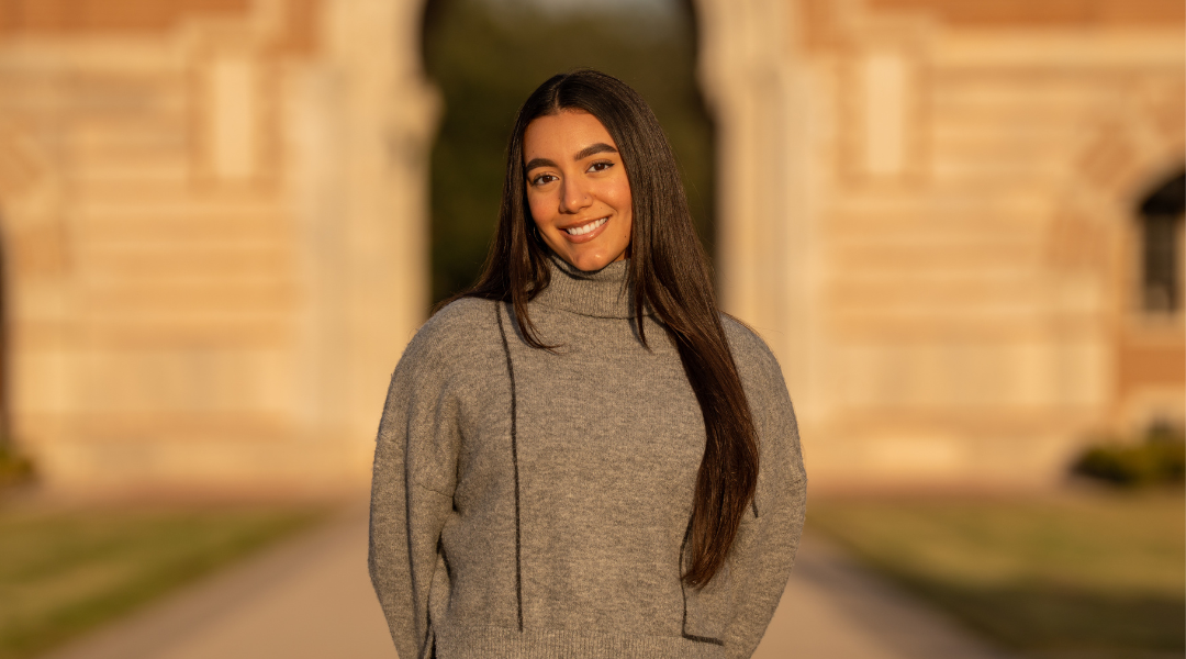 Professional master's of environmental science graduate in front of Lovett Hall