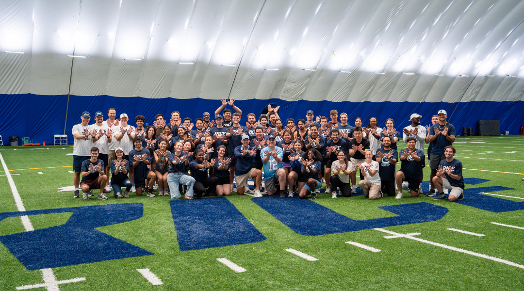 Graduate students with the Rice football team