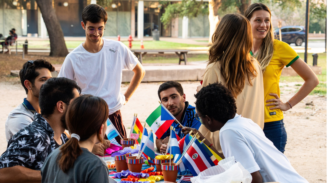 A group makes paper flowers at Festiva de Independencia