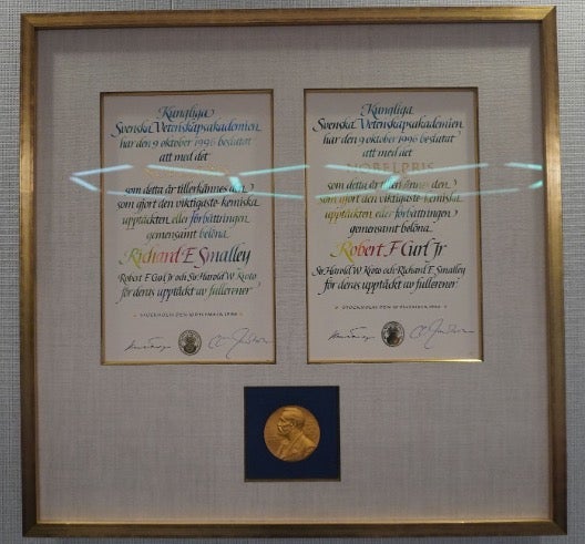 Picture description: The Nobel Prize – securely but proudly displayed in the SCI offices – serves as an inspiration for the grand scientific endeavors at Rice, a breeding ground for “prepared minds.”
