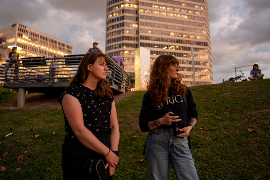 Andrea Rummel and Shockney await the nightly flight of the Waugh Bridge bat colony