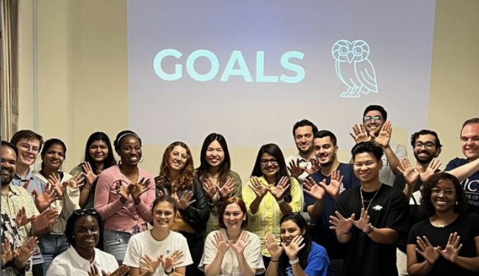 group of students in front of a screen where "goals" is outlined