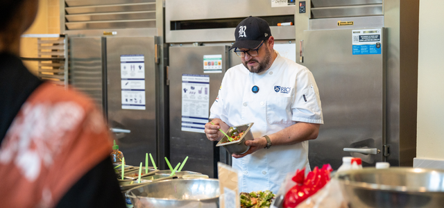 Chef Joe Stayshich shows students how to prepare a salad