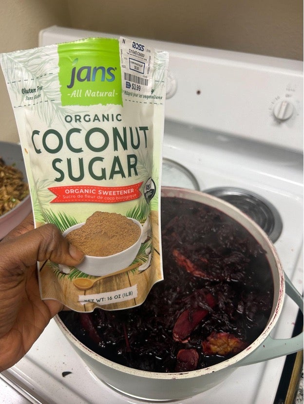 Adding sugar to Zobo