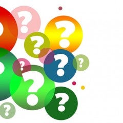Colorful bubbles of varying sizes filled with question marks
