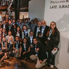 Rice's recruiting weekend. Students in paleontology hall.