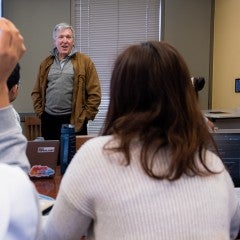 A professor lecturing to his students.