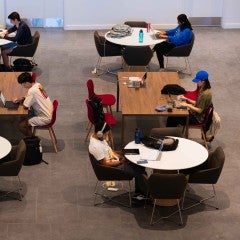 Students typing on their computers.