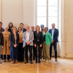 Photo of Me (Jae’la Solomon, back row second to right) and other attendees of the Reimagining Reproductive Health and Digital Care workshop at a closing reception. Credit: @Insolyt