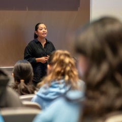A graduate student teaching a class of undergraduates