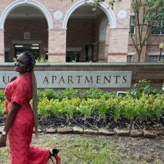 Osinachi standing in front of RGA