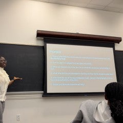 Osinachi Okafor lecturing in the classroom