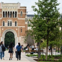 students walking by Sallyport with six country's flags pasted over the top of the image