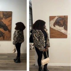 Osinachi Looking at Art work on a wall