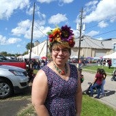 Patty Diaz outside with flowers in her hair