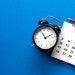 Clock and calendar on a blue background