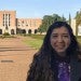 Astrid Campos in front of Fondren Library on the Rice campus