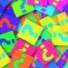 A colorful series of post its with question marks on them