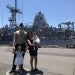 Geovanny Montemayor and family in front of a Naval ship