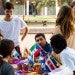 A group makes paper flowers at Festiva de Independencia